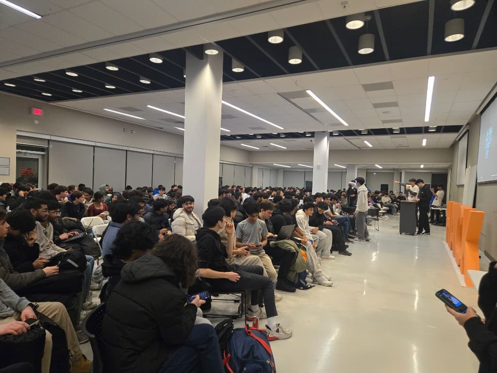 A packed hackathon keynote hall filled with attendees